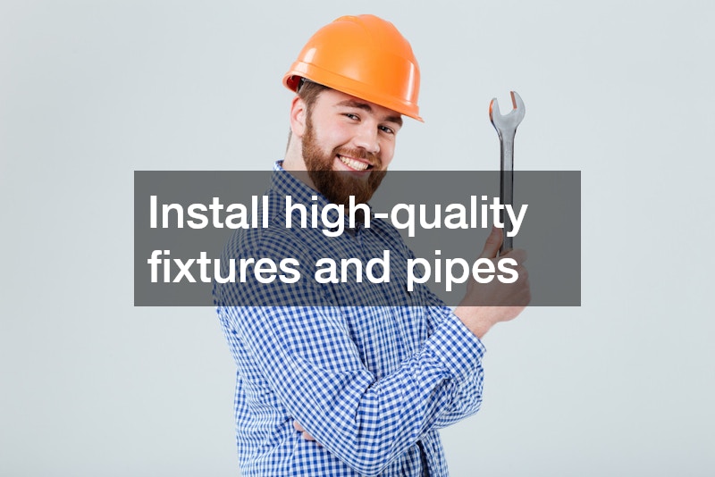 plumber wearing a hard hat and holding a wrench